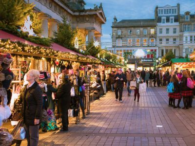 Edinburgh, UK - December 11, 2013: People browsing market stalls off Princes Street in central Edinburgh, during the run-up to Christmas.

Christmas market stalls in central Edinburgh during December.