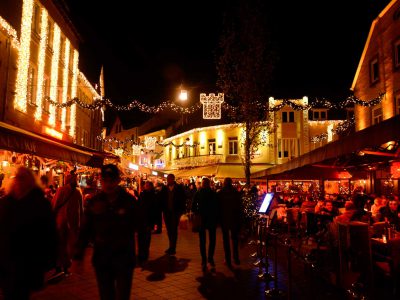 A crowded people passing by at Christmas market in Valkenburg little village in the outdoor area in The Netherlands  by before COVID-19